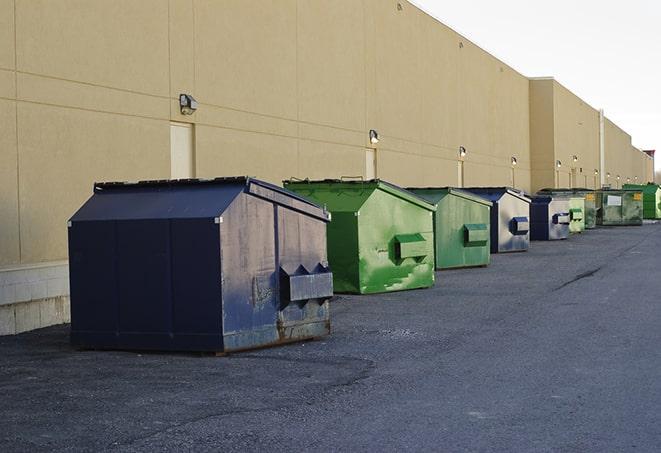 a row of large construction dumpsters on-site in Beverly, NJ